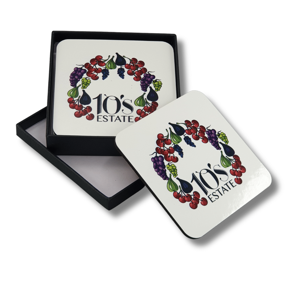 personalised-mdf-drink-coasters-estate-gift-box Personalised square MDF drink coasters with 10's Estate fruit-themed logo, displayed with a black presentation gift box.